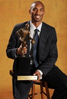 Kobe Bryant Holds His MVP Trophy 
