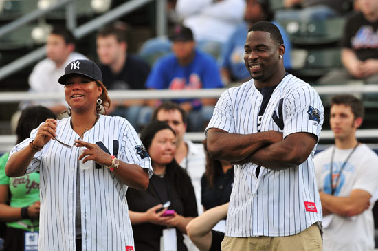 Queen Latifah & Justin Tuck of the New York Giants // 2009 Atlantic League All-Star Game and the Hot 97 vs. KISS-FM Celebrity Softball Showdown