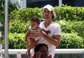 Gabriel Aubry and his daughter Nahla poolside in Miami (July 7th 2009)