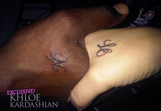 Khloe Kardashian and Lamar Odom's matching tattoos - "KO" (Lamar's hand) and "LO" (Khloe's Hand)