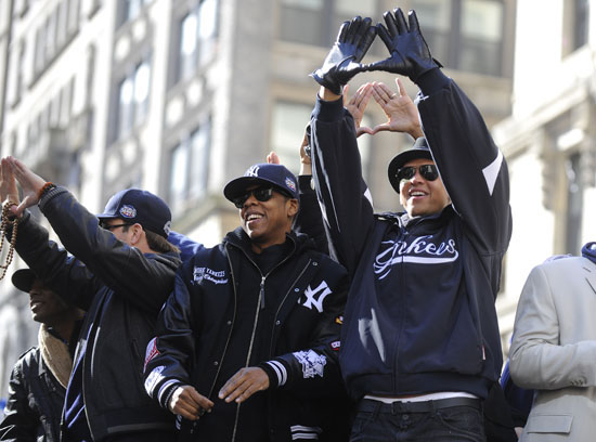 Singer Jay Z perform checks out the World Series trophy after the New York  Yankees were honored for their World Series win at City Hall following a  ticker tape parade on November