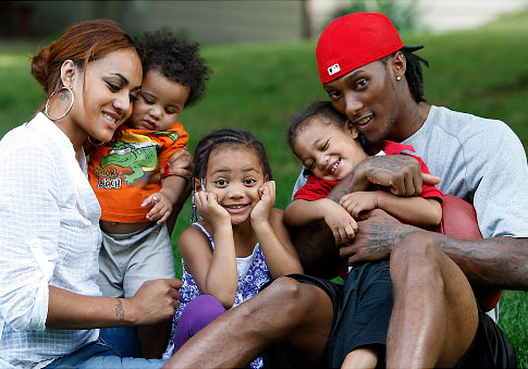 Chris Henry (of the Cincinnati Bengals) and his family: his fiancee Loleini Tonga and their kids DeMarcus, Seini and Chris Jr.