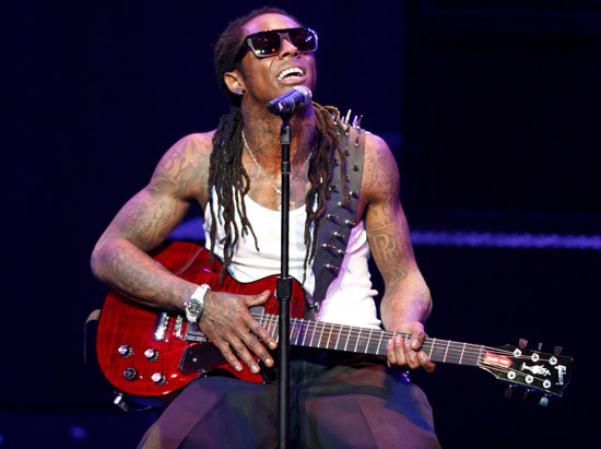 Rap star Lil Wayne and 11 other people in his crew were detained by U.S. 