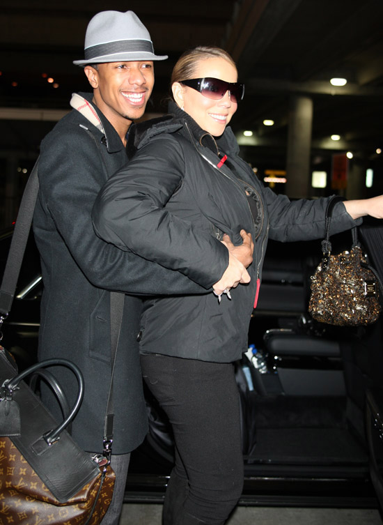 Nick Cannon and Mariah Carey outside JFK Airport in New York City - December 29th 2009