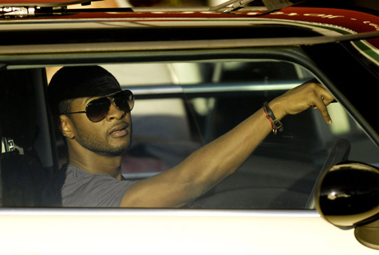 Usher spotted in traffic in St. Barth's sitting in his Mini Cooper - January 2nd 2010