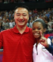 Gabby Douglas and coach Liang Chow celebrate her second gold medal win -- 2012 London Olympics