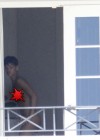 Rihanna spotted on her hotel balcony in Barbados (Dec 22 2012)