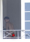 Rihanna spotted on her hotel balcony in Barbados (Dec 22 2012)