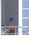 Rihanna spotted on her hotel balcony in Barbados (Dec 22 2012)