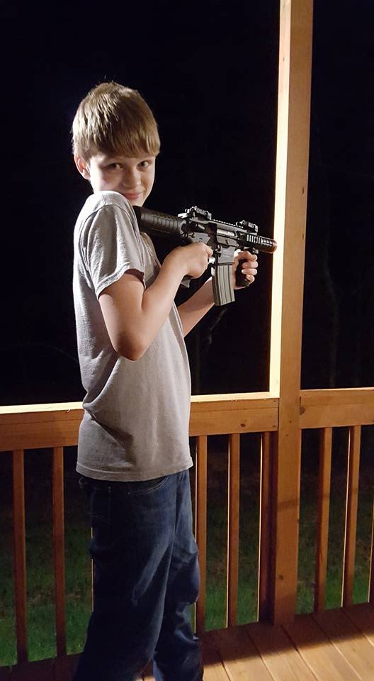 An unconfirmed photo of Jesse Osborne holding an assault rifle.