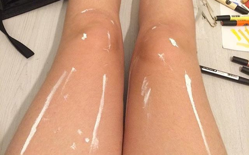 oily-shiny-plastic-legs-white-paint-photo
