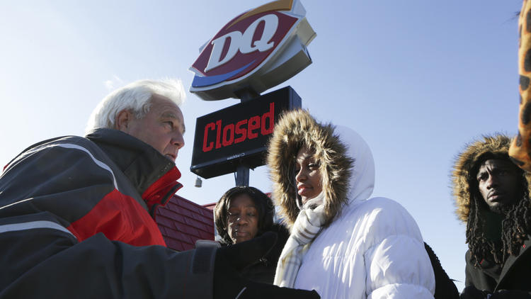 Zion mayor Al Hill, left, talks with Deianeira in front of the Dairy Queen on Jan. 7, 2017