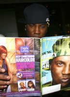 Young Jeezy reading his issue of VIBE Magazine at the Hotel Gansevoort