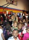 Ludacris, his daughter, and kids from the Mount Vernon Boys’ Club