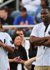 Queen Latifah & Justin Tuck of the New York Giants // 2009 Atlantic League All-Star Game and the Hot 97 vs. KISS-FM Celebrity Softball Showdown