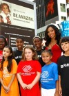 Ashanti and kids from the Boys & Girls Club // Unveiling of Ashanti’s “Be Amazing” Billboard in Times Square, New York City