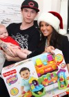 Adrienne Bailon delivering Christmas gifts to sick children at the Beth Israel Medical Center in New York City