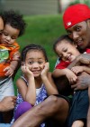 Chris Henry (of the Cincinnati Bengals) and his family: his fiancee Loleini Tonga and their kids DeMarcus, Seini and Chris Jr.