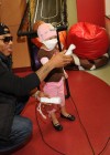 Nelly visits sick children and delivers Christmas gifts at the Aflac Children’s Cancer Center of Atlanta