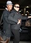 Nick Cannon and Mariah Carey outside JFK Airport in New York City – December 29th 2009