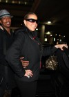 Nick Cannon and Mariah Carey outside JFK Airport in New York City – December 29th 2009