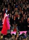 Kim Kardashian blows a kiss to Reggie Bush // Heart Truth Fall 2010 Fashion Show during the Mercedes-Benz Fashion Week 2010