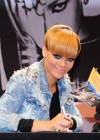 Rihanna signing autographs at MediaMarkit home electronics store in Berlin, Germany