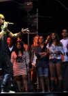 Jay-Z performs as Angie (Beyonce’s cousin), Beyonce and Maria Shriver watch // 2010 Coachella Festival – Day 1