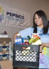 Raven Symone helping Pepsi drop off food at Second Harvest Bank in New Orleans
