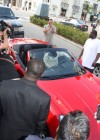 T.I. with his fiance Tiny in his Ferrari after shopping at Louis Vuitton on Rodeo Drive in Beverly Hills – April 26th 2010