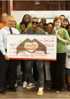 Chris hands over a $25,000 check to the Central Virginia Food Bank