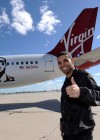 Drake in front of his new Virgin America Airlines plane “Air Drake”