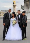 Will & Jada posing with a newlywed couple while on location for Willow’s photoshoot in Paris, France