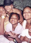Rihanna with her sister Kandy and her two nieces Brandy Crystal (Ri’s little bros Rorrey and Rajad are on the left)