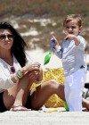 Kourtney Kardashian, Scott Disick and their son Mason at Manhattan Beach in California