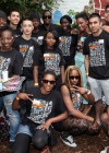 Diddy and Dawn Richard pose with the volunteers