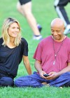 Russell Simmons & Heidi Klum doing yoga at Riverbank State Park in New York City