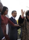 Singer Aretha Franklin (R) accepts applause as she finishes her performance with U.S. President Barack Obama, first lady Michelle Obama and Harry Johnson, president and CEO of the MLK National Memorial Project Fund (L)