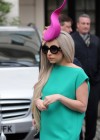 Lady Gaga wearing a bright pink “sperm hat” in London, England
