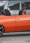 Chris Brown with Karrauche and friends riding in a bright orange chevy impala drop-top hoopty