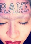 Drake fan forehead tattoo