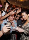 Kim Kardashian posing with fans