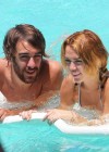 Miley Cyrus and Cheyne swimming at a hotel in Miami