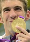 Michael Phelps holds up his 15th gold medal (19th overall) at the 2012 London Olympics