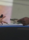 Karrueche gets a $20 bill from Chris Brown’s bodyguard