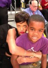 Rihanna (with rapper Game’s son Harlem) at Knicks/Lakers basketball game in Los Angeles – Christmas 2012