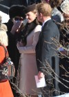 Kate Middleton shows off her baby bump at a friend’s wedding