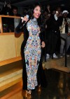 Lil Kim pregnant, showing off her baby bump at NYFW