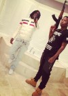 Chief Keef & Ballout posing with guns on Instagram