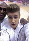 Justin Bieber with Floyd Mayweather at L.A. Clippers vs. OKC Thunder Game in Los Angeles (Game 4 of the 2014 NBA Playoffs)